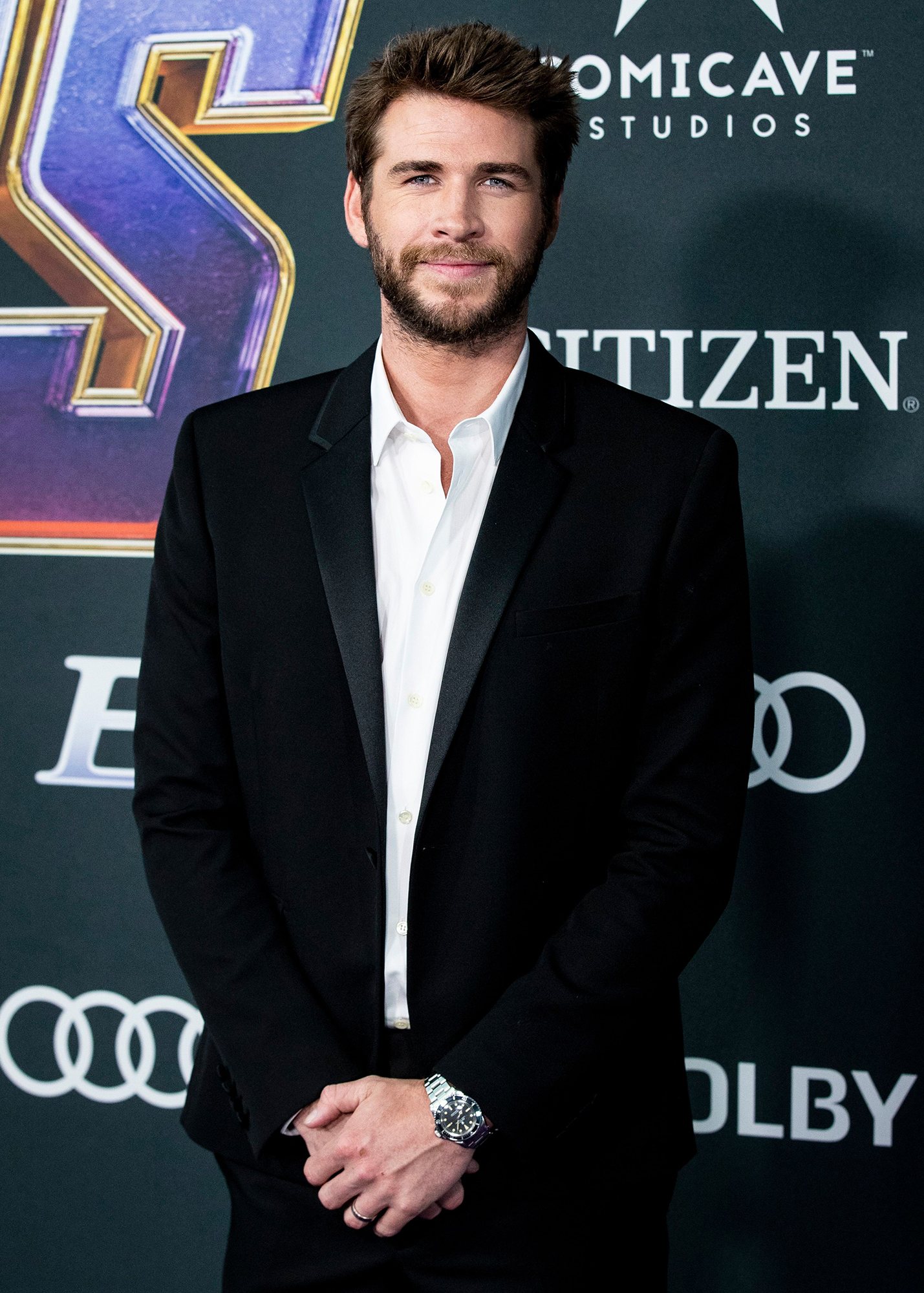 Shirtless Liam Hemsworth Cuddles — and Kisses — His Beloved Dog Dora in Adorable Photo